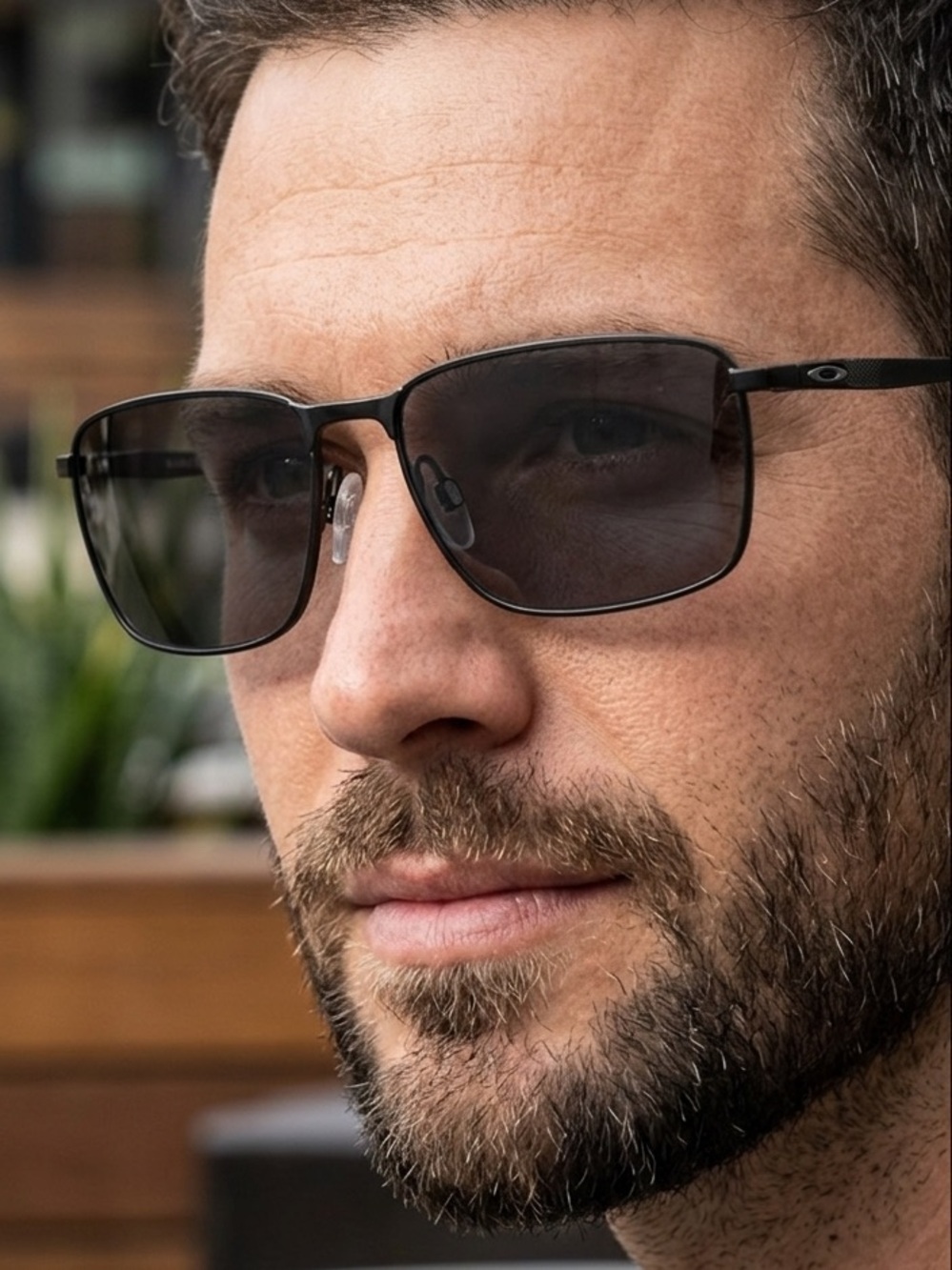 Oakley Black Metal Frame Sunglasses with Dark Lenses